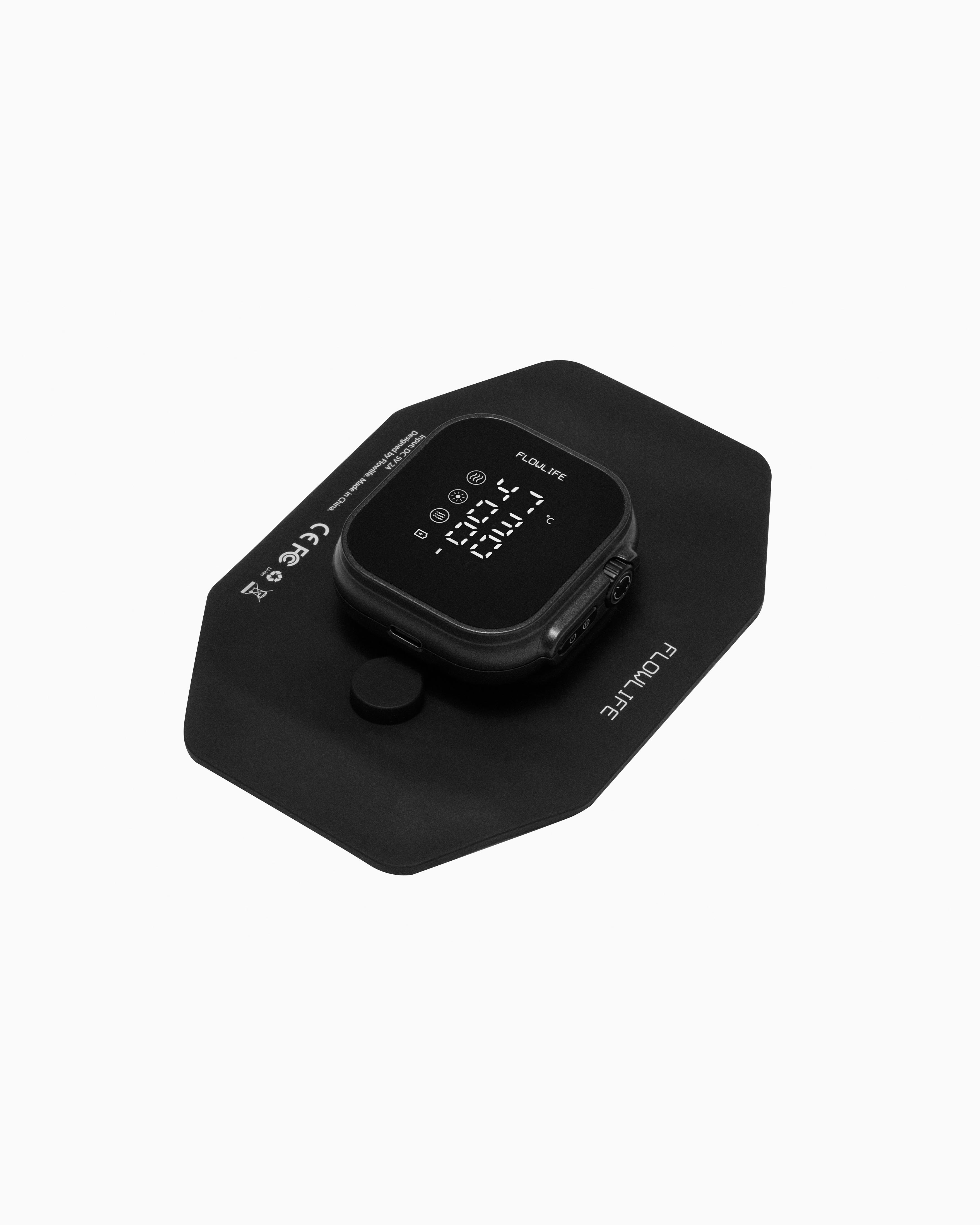 Flowtherma Spot matte black device for targeted thermal therapy and red light, featuring a clear digital display.