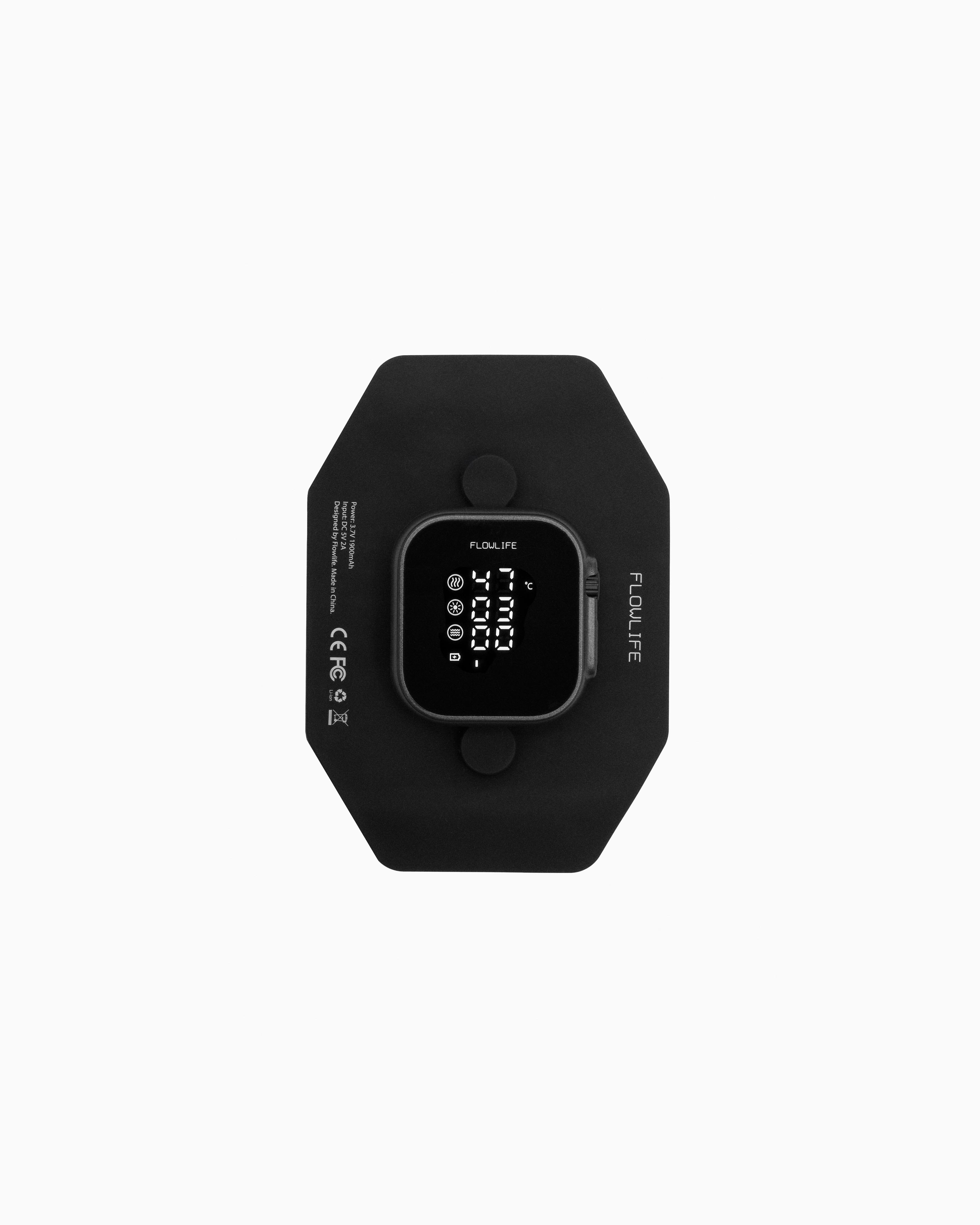 Flowtherma Spot recovery tool featuring a digital display for controlled heat, red-light therapy, and vibration.