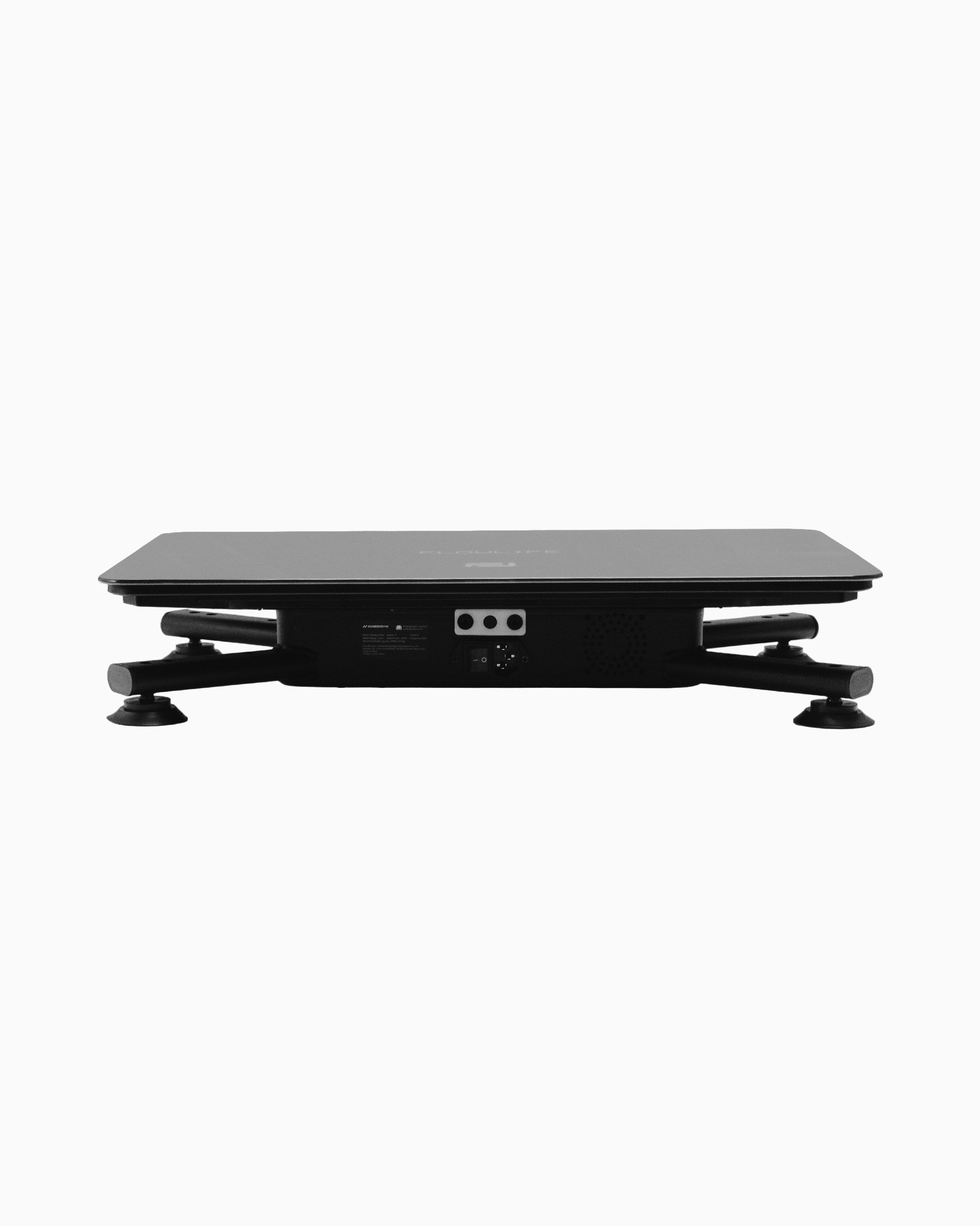 Flowplate Vibe Pro seen from the side, with low-profile platform, four support feet and connection ports.